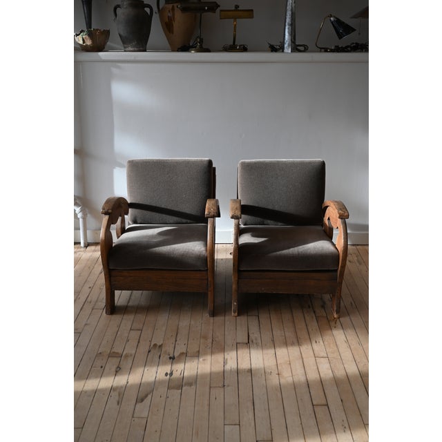 Cool carved art deco period lounge chairs from Denmark. Solid wood frames with a curved x pattern on rounded arms. So...
