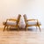 Fully restored pair of Model 137 lounge chairs, designed by Italian architect Carlo de Carli and produced by Singer & Sons...