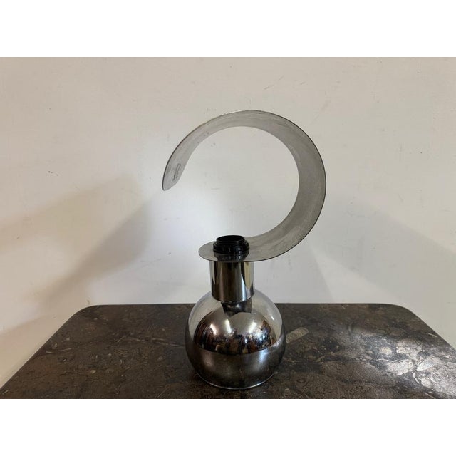 A striking example of mid to late 20th Century design, this sculptural table lamp is crafted from chromed metal, embodying...