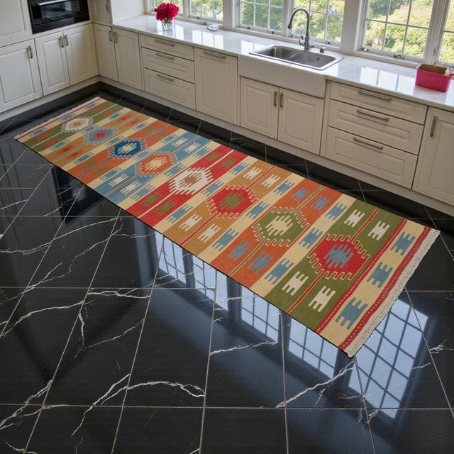 Handwoven in the Oushak (Usak) region of Western Turkey in the 1980s, this long wool kilim runner brings Aegean charm into...