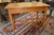 This is a nice looking antique pine work/side table. Great full length drawer with divisions, wooden knobs, & dovetails....