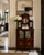 A particularly elegant antique Edwardian mahogany display cabinet retaining its original mirrored superstructure and...