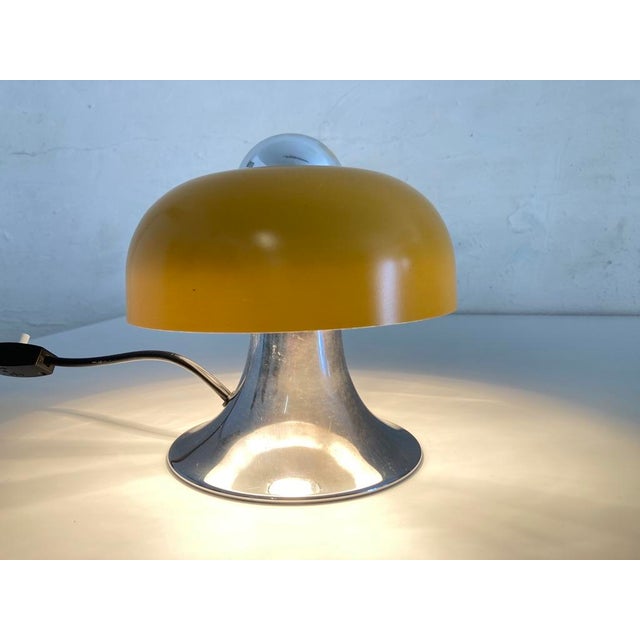 Table lamp from the 1970s, single bulb, E27 metal shade socket. Chrome-plated metal base, yellowish lacquered finish. Good...