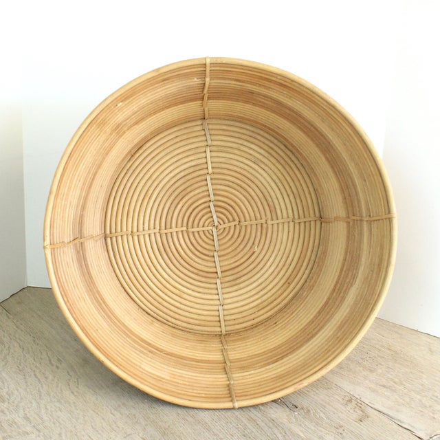 Add a rustic touch to your decor with this coiled rattan basket. Perfectly sized for books, magazines, blanket's, etc.