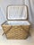 This is a vintage woven basket. This carrying basket features a wide weave with wooden top frame and wooden handles. A...