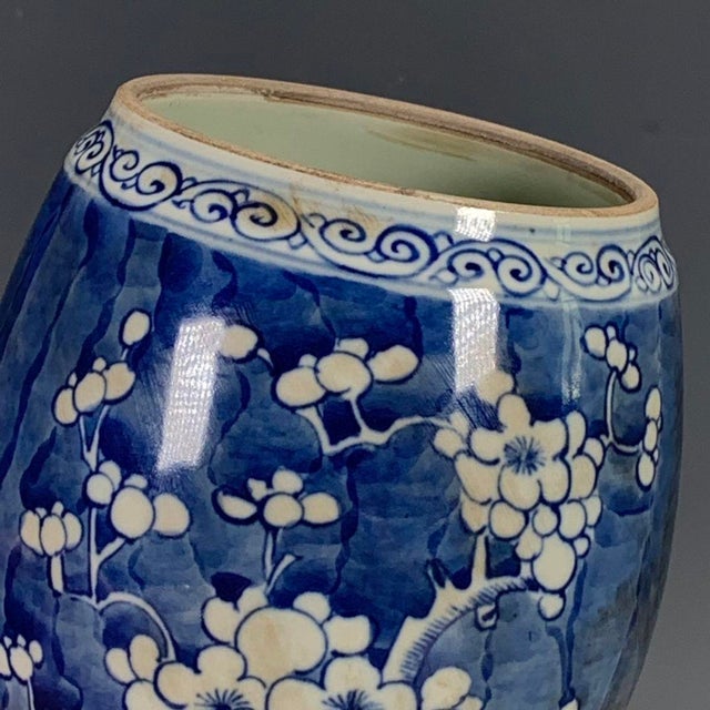 Bring timeless elegance to your home with this vintage Chinese blue and white porcelain jar. It features the classic...