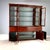 Mahogany and crotchet bookcase. Split front with a projecting central element. Upper section with blown-glass doors...