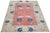 Hand-knotted with care using traditional rug making techniques, this wool rug blends timeless craftsmanship with a modern...
