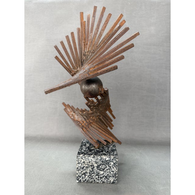 Welded iron sculpture on a granite base. Artist: Sergio Castillo Mandiola. Chilean artist, winner of the National Prize...