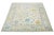 This wool rug, designed in the Oushak style, showcases a hand-knotted beige field. It exudes a contemporary aesthetic...