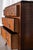 This 1800s vintage walnut dresser features beautifully figured wood grain across its drawer fronts, highlighting the...