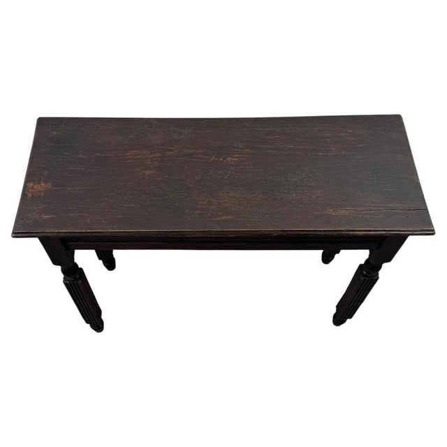 A charming early 20th-century English Edwardian side table, well crafted from oak and distinguished by its elegant...