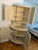 Vintage Gustavian-style corner cabinet crafted in solid wood, featuring elegant architectural lines and a beautifully...