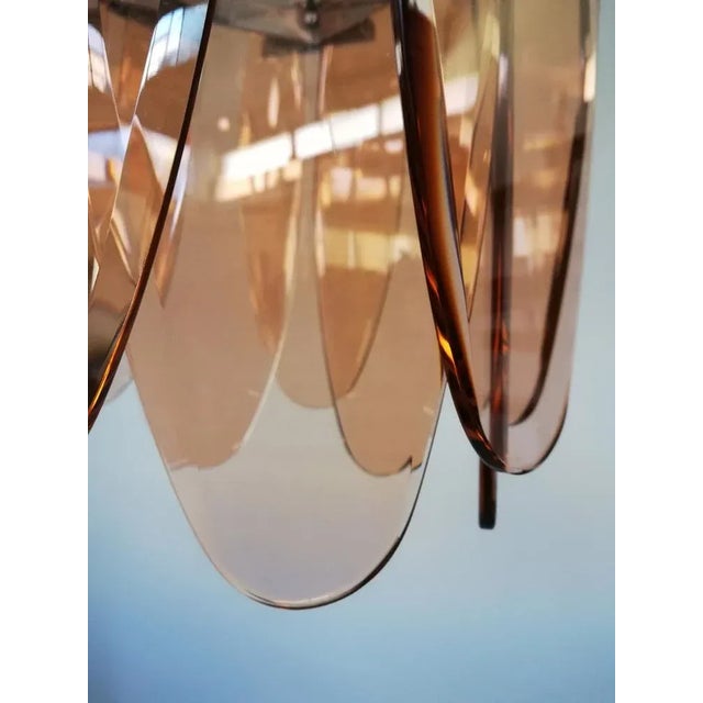 Suspension lamp dating from the 1960s to the 1970s, made in Italy by the Veca company. Thick oval glass panes of the...