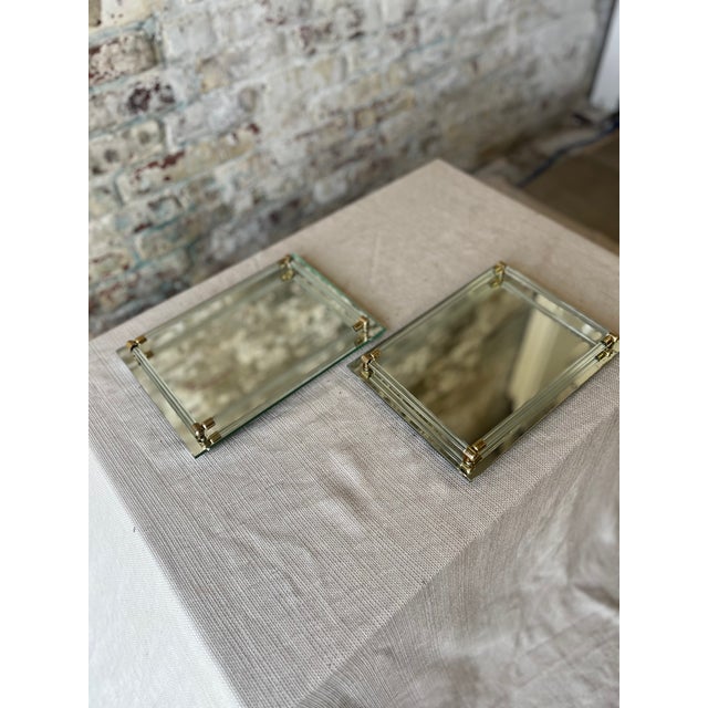 Add a touch of vintage elegance to your dresser, vanity, or coffee table with this pair of mirrored glass trays featuring...