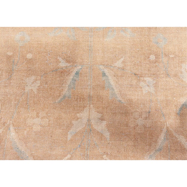 This stunning oversized antique North Indian rug from the 1920s epitomizes quiet sophistication and regal elegance....