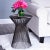 An irresistible design aesthetic, this End Table spreads out strands of iron from the smallest band of three â€“ the waist...
