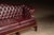 Oxblood Red Vintage Chippendale-Style Camelback Chesterfield Leather Sofa in Oxblood For Sale - Image 8 of 12
