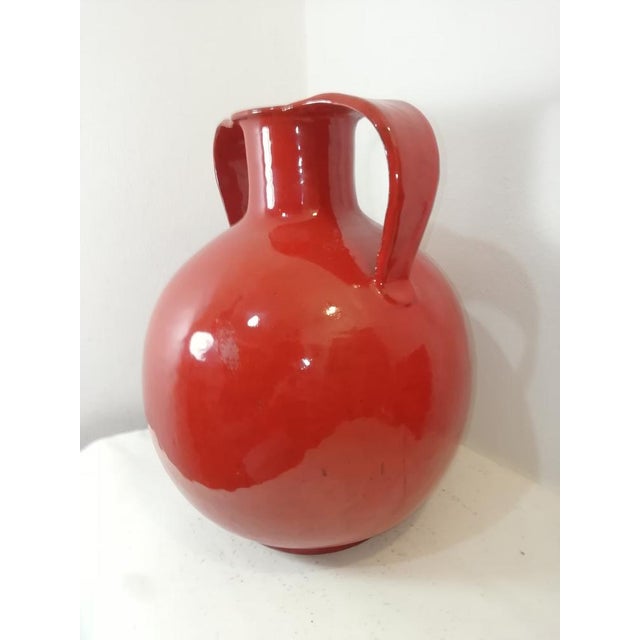 Large, original vintage ceramic vase in the shape of an amphora. A beautiful, intense, fiery red color. Given its large...