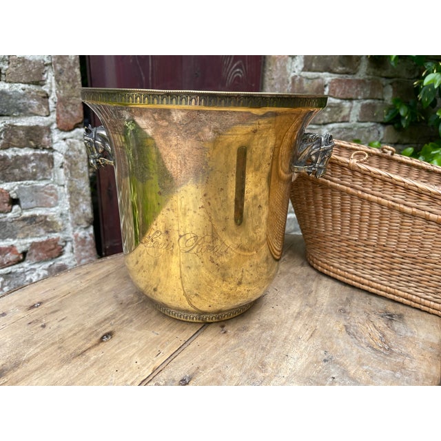 A unique champagne/wine cooler from France made for the champagne house Louis Roederer. The cooler is silver plated over...