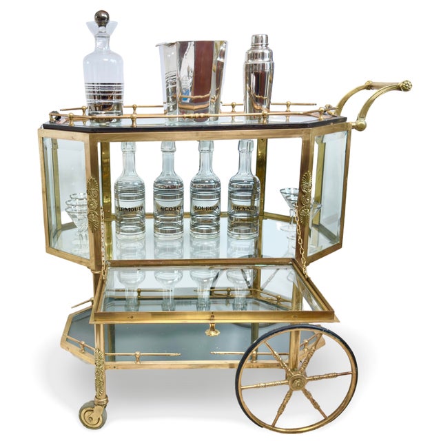 Introducing our stunning Mid-Century French Tea/Bar Trolley Cart, a true embodiment of Hollywood Regency style. This...