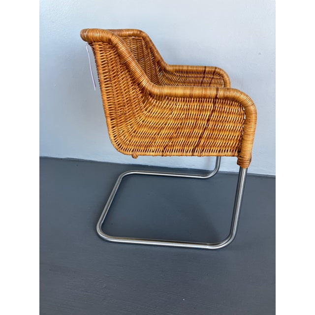 This is a lovely vintage wicker armchair attributed to Harvey Probber dating from the early 1970s. This is the 'step-arm'...