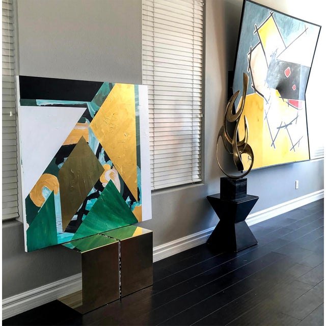 This piece is absolutely stunning. At 48" x 48" this geometric painting is evocative of a green geometric jungle, with...
