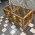 Two Bamboo glass top side tables with unique twisted arch design sides perfect for displaying plants or to set a drink on...