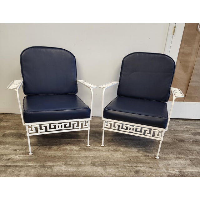 An exceptional pair of vintage lounge chairs embodies the sophisticated allure of Palm Beach Regency design. These chairs...