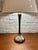 Elegant vintage accent table lamp manufactured by Laurel Lamp Company. The lamp features a sculptural polished-chrome base...