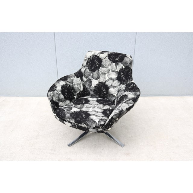 The Bob swivel lounge chair's modern beauty and smart design fit seamlessly into any environment and among mid-century...