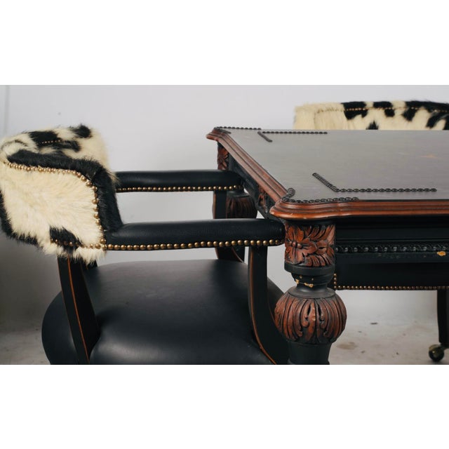 Hooker Furniture Ebonized Leather Games Table & Four Cowhide Armchairs A striking five-piece games table ensemble by...