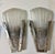A pair of French Art Deco wall sconces by French artist Genet et Michon. Having a clear and frosted glass shade with...