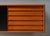 Sweden, ca. 1960s. A versatile wall-mounted cabinet by Nils Jonsson for Hugo Troeds. Features teak construction with black...