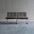 This pair of mid-century modular lounge chairs features a rich brown and off-white woven geometric pattern, set against...