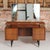 Mid Century G-plan Librenza tola and black dressing table, circa 1960s. Five drawers with brass handles and 3 mirrors....