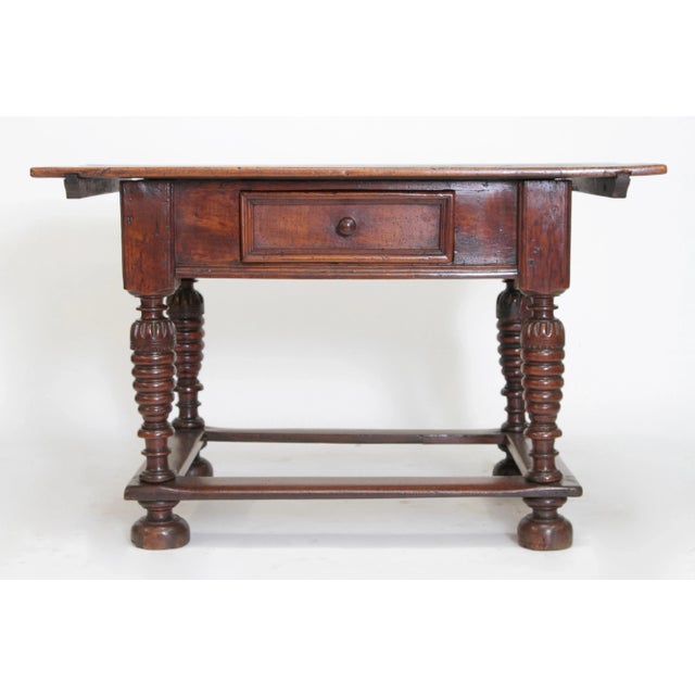 A Matched Pair of Similar 18th Century Spanish Colonial Tables with slightly varying dimensions: One: 30”H x 47.5”W x 30”D...