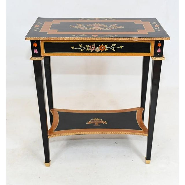 Gorgeous pair of French Empire style side tables Feature a lacquer finish and hand painted floral motifs Very colourful...