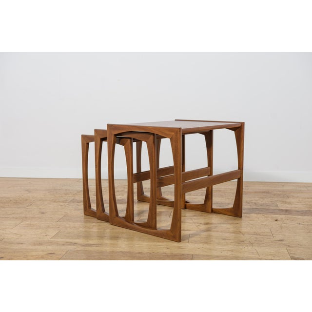 This set of three teak nesting tables was designed by R. Bennett for the renowned British manufacturer G-Plan during the...