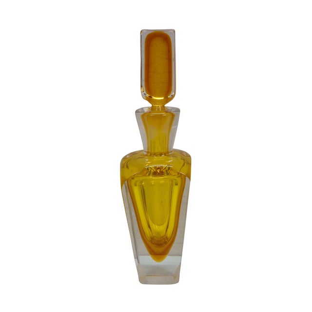 Mid century Italian Murano glass decanter bottle with stopper featuring the Sommerso or submerged technique that shows...