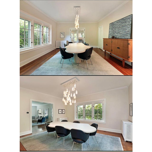 Striking Bocci 21.26 chandelier featuring 26 hand-formed porcelain pendants suspended in a dramatic multi-drop...