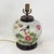 This antique table lamp is repurposed from an authentic white porcelain vase decorated in a vibrant Famille Rose palette....