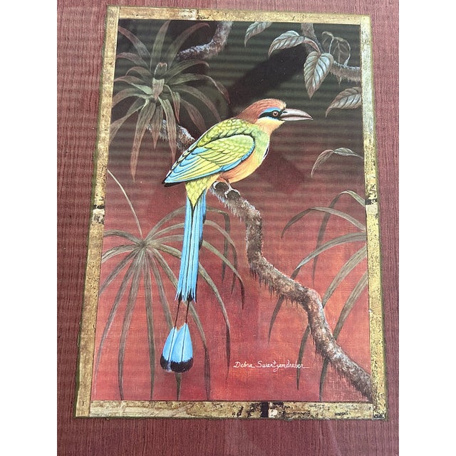 Offering a pair of beautifully framed tropical bird prints. The dark stained bamboo is the star here and the prints...