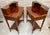 Pair of nightstands or secretary desk with French marquetry on the top, each one slightly oval in shape with a central...