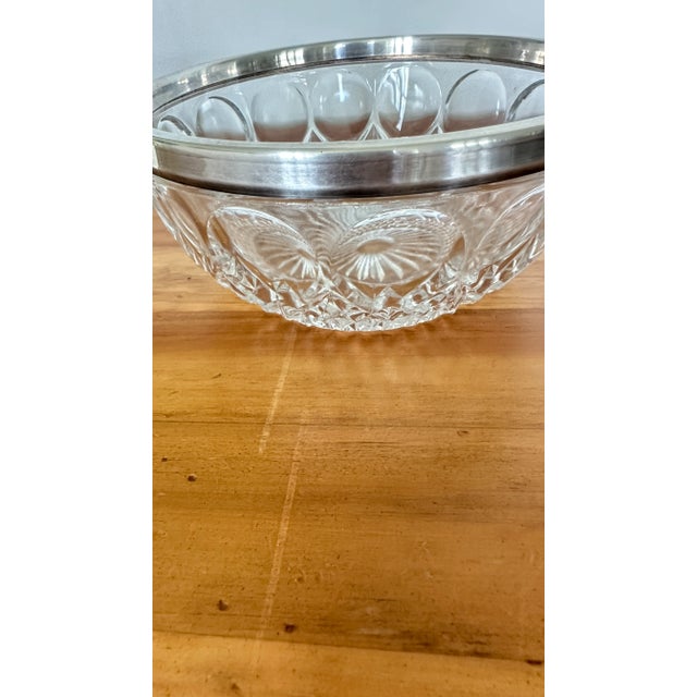 Vintage crystal bowl with 1/2" silver plated rim band around bowl. Both marked made in Germany on rim. Circles with...