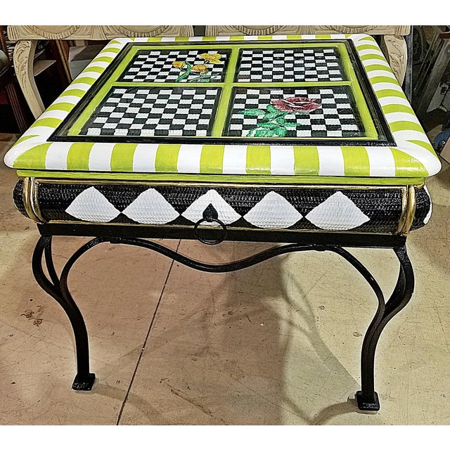 Fun and creative, a 1970-80s paint decorated beveled glass top caned and wrought metal end or side table, one drawer...