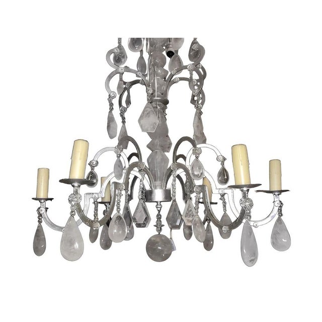 Striking and elegant Italian 20th-century chandelier, crafted in silver leaf–finished wrought iron and richly adorned with...