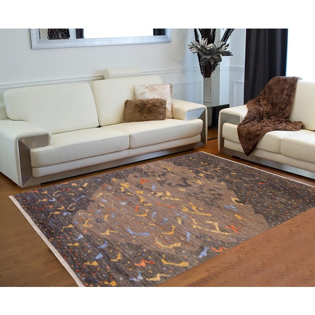Elevate your space with the timeless artistry of a handmade Moroccan rug, meticulously crafted by skilled artisans using...