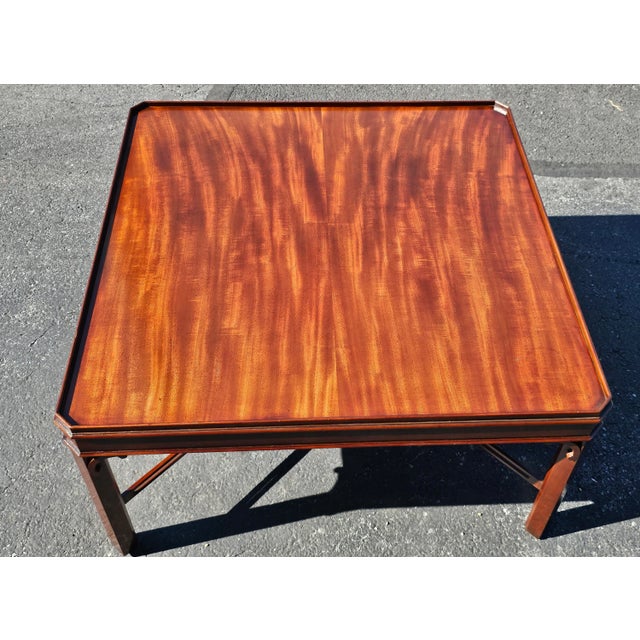 A 20th Century George III Style Solid Mahogany Square Coffee Table with pierced Stretcher. Measures 37" wide , 37" in...
