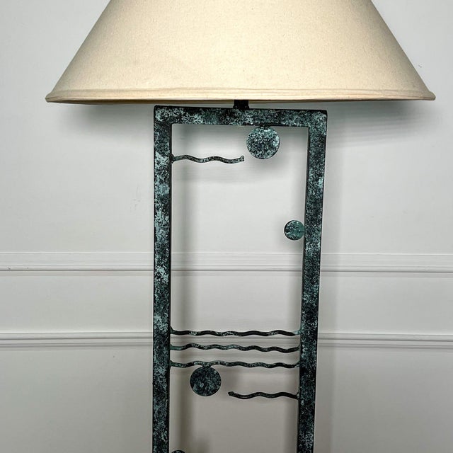 Exceptional modern iron floor lamp featuring wavy motif with spheres a faux verdigris finish. A rare example of postmodern...